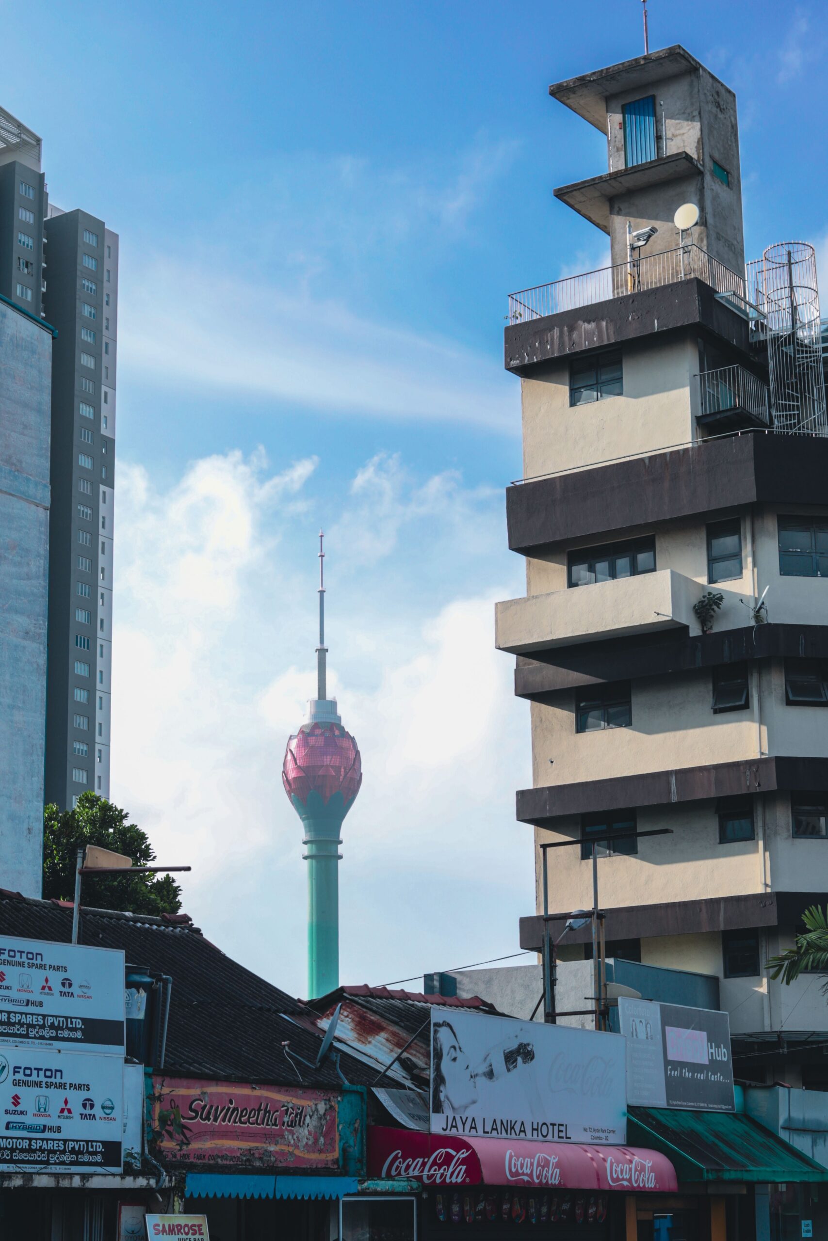 pexels-photo-33512038-33512038 A view of Colombo's Lotus Tower amidst urban buildings on a bright day.